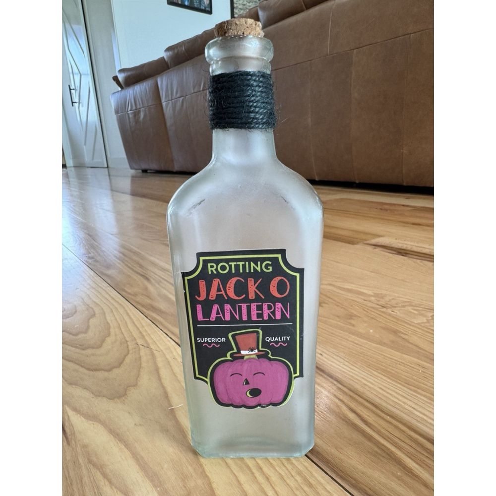 Ashland Electric Halloween Glass Bottle Tabletop Decor Rotting Jack-o-Lantern